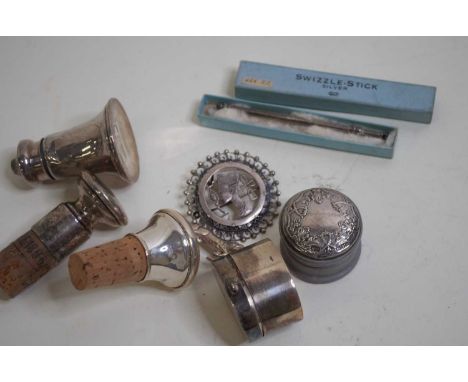 A mid 20th century silver propelling cocktail swizzle stick in original box, together with a white metal brooch in the Egypti