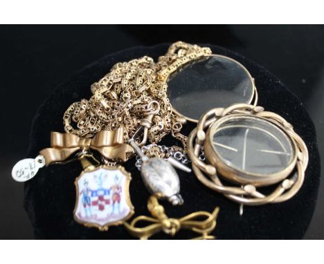 A circa 1900 gilt metal guard chain, with a later applied 9ct gold fastener, 148cm; together with a gilt metal ribbon brooch;