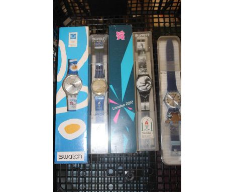 A collection of assorted Rotary Editions wristwatch dials; together with various boxed Swatch wristwatches