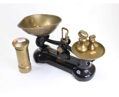 A brass novelty moneybox in the form of a pillar box, height 16cm, together with a set of cast iron scales and weights by the