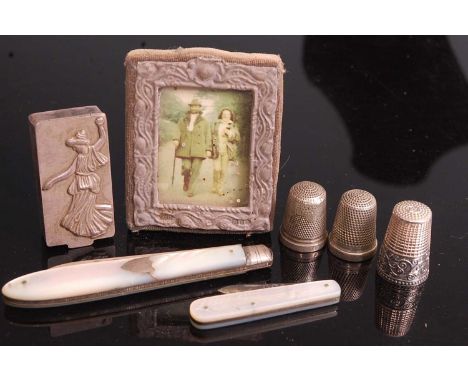 A miniature silver clad easel photo frame 6x5cm, together with a continental silver pocket snuff box of rectangular form, the