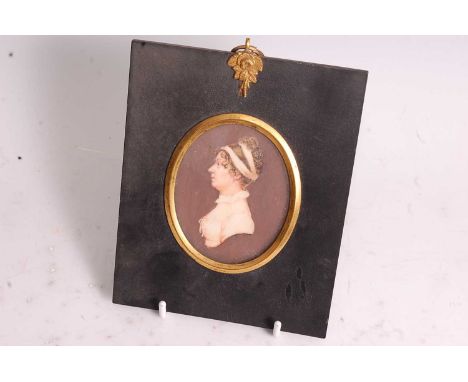 19th century English school - Quarter-length profile portrait of a lady, miniature watercolour on ivory(?), within ebonised s