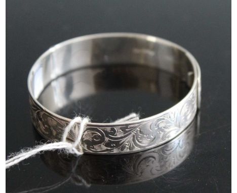 A silver and engraved child's bangle, Chester 1938, dia.56mm