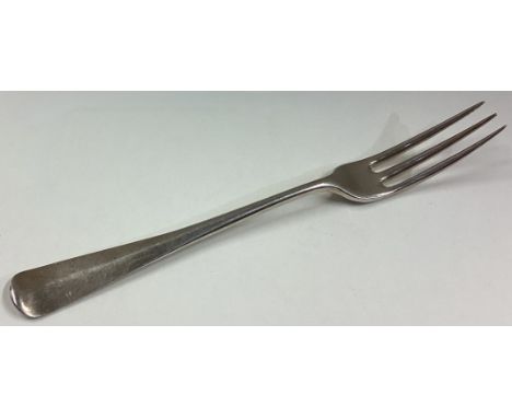 An 18th Century three-pronged silver fork. Approx. 36 grams. Est. £50 - £80.
