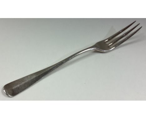 An 18th Century three-pronged silver fork. Approx. 33 grams. Est. £50 - £80.