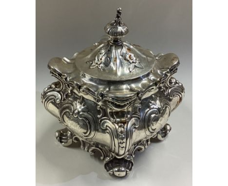 A Victorian silver tea caddy with lift-off cover and chased decoration. Approx. 200 grams. Est. £200 - £300.