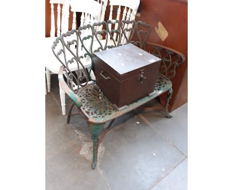 A wrought iron garden bench 