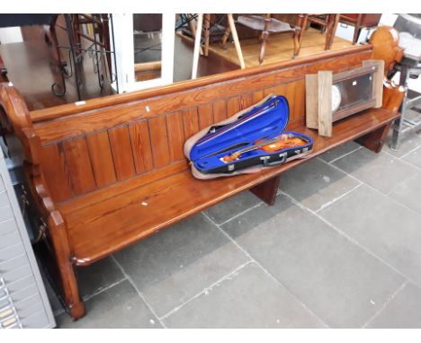 A large pew church bench 