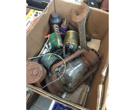 A box of various garageware to include lamps, blowtorches and a large spanner 