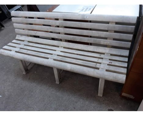 A white plastic garden bench 