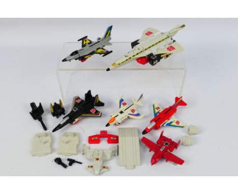 Transformers - A group of vintage transformers including Powerglide, Fireflight, Slingshot, Silverbolt, Air Raid and Skydive.