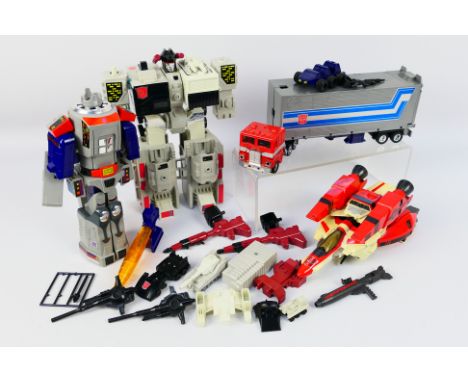 Transformers - A group of vintage Transformers, Jetfire, Galvatron, Optimus Prime and Metroplex. They show some signs of age 