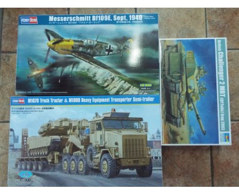 Hobby Boss and Trupeter - three model kits comprising Hobby Boss 1:18 Messerschmitt Bf109E (Sept 1940) # 81809, 1:35 M1070 Tr