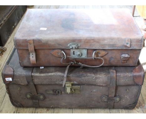 A vintage canvas and leather travelling trunk marked Drew & Sons, Piccadilly Circus and an vintage leather suitcase