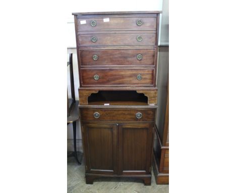 An Edwardian mahogany commode in the form of a chest of drawers and an Edwardian oak two door, one drawer cupboard