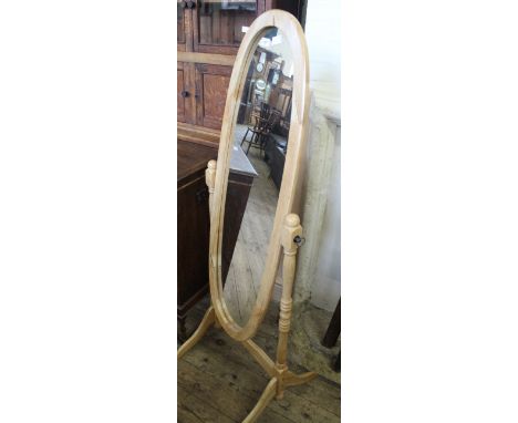 A modern light wood cheval mirror