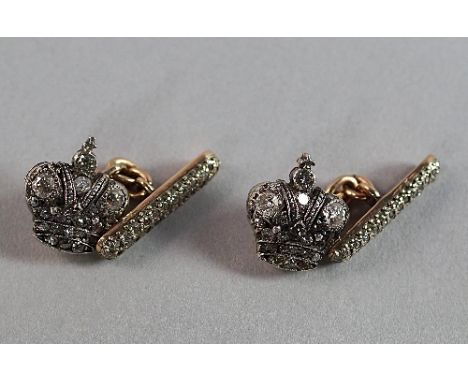 A pair of Russian 56 standard gold and diamond set cufflinks, St. Petersburg, each in the form of a crown, with diamond studd