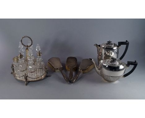 A collection of silver plate to include a four piece tea service, a plated cruet stand with glass bottles, further items of s