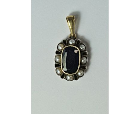 A sapphire and split pearl pendant, 19th century, the oval cut sapphire with a border of split pearls, set in unmarked yellow