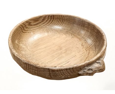A Robert 'Mouseman' Thompson of Kilburn adzed oak nut bowl, with carved mouse signature, diameter 16cm