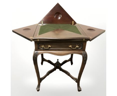 A Victorian mahogany envelope card table, 55 cm wide unextended.
