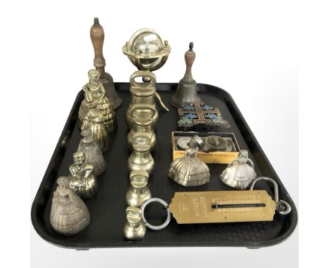 A group of graduated brass weights, figural hand bell, bowls, miniature globe, pocket balance scale etc 
