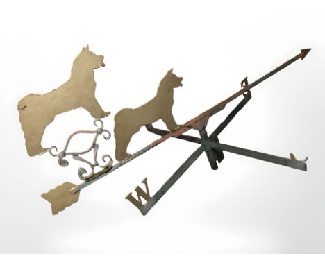 A painted cast iron weather vane surmounted by two dogs, width 153 cm 