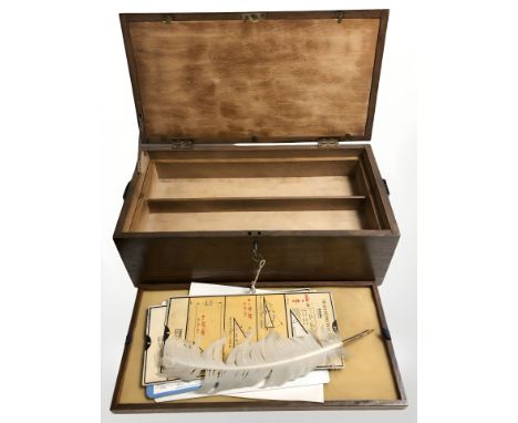 An oak two division storage box containing feather quill, a group of metric converter cards and trigonometrical ratio cards.