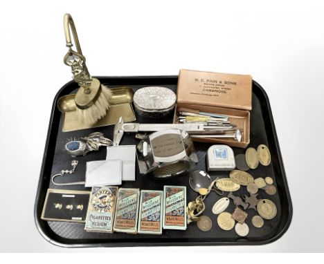 A tray of mixed collectables, Wills cigarette cards, large chromed paperweight in the form of a nut, tools, brass plaques and