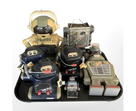 A group of novelty radios and a cassette player in the form of robots, battery operated tin plate walking robot 