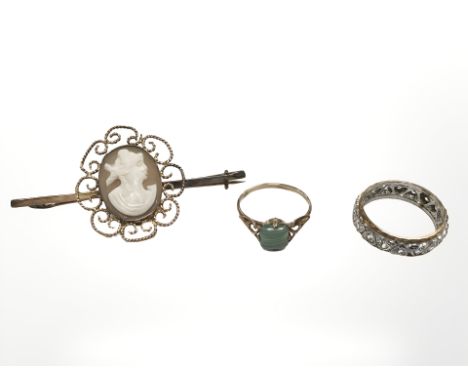A 9ct gold cameo brooch, similar hard stone ring, and a two-tone 9ct gold eternity ring.  CONDITION REPORT: 7.6g gross
