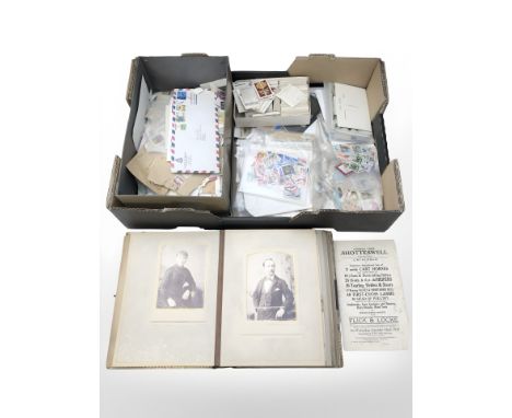 A large quantity of stamps, postcards, John Player & Son cigarette cards, a leather bound photograph album of portrait photog