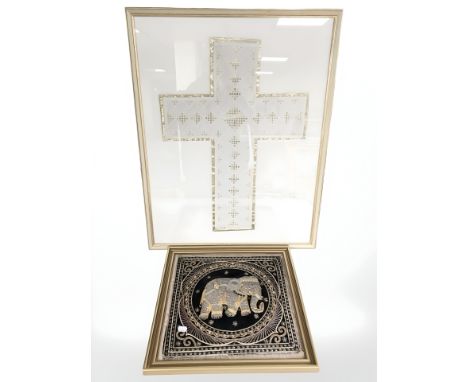 An Indian embroidered panel depicting an elephant and a further linen crucifix embroidery, overall 77 cm x 59 cm.
