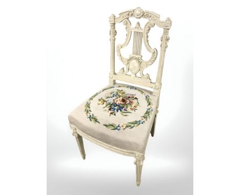 A painted French occasional chair in tapestry fabric.