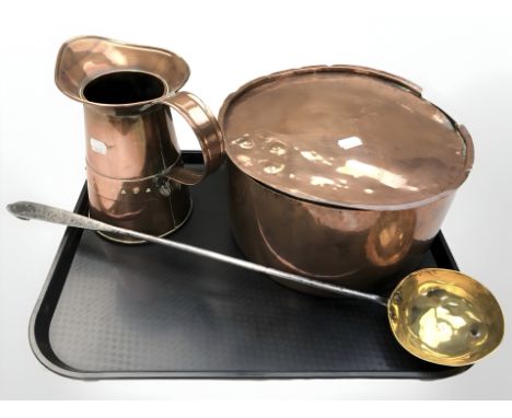 A 19th century copper cooking pot, further jug and a brass ladle with steel handle 