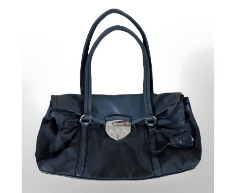 Prada : A black leather and nylon shoulder bag.  