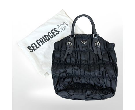 Prada : A black nylon Tessuto Gaufre tote bag, with authenticity card, numbered BN 1611, with Selfridges dust bag.