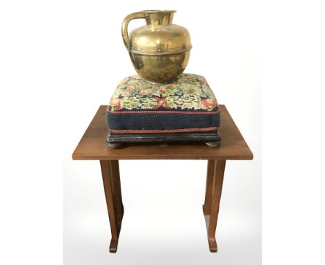 A 20th century teak drop leaf table, width 62 cm extended, tapestry footstool and a brass jug 