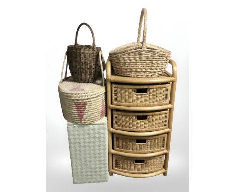A wicker four drawer chest, width 53 cm, three wicker baskets and a linen hamper 