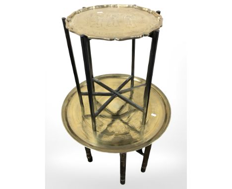 An Eastern bobbin turned brass topped table with Islamic script, diameter 59 cm, together with a further oriental table on me