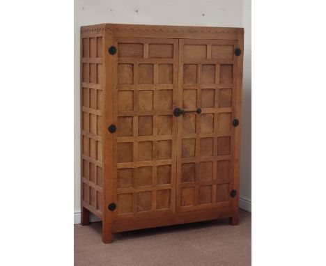 Yorkshire oak - 'Mouseman' adzed, panelled double wardrobe (W122cm, H167cm, D58cm), by Robert Thompson of Kilburn Condition R