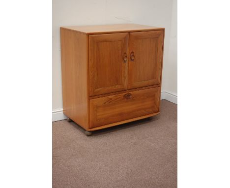 Ercol light elm tallboy cabinet, enclosed by two doors, with fall front compartment below, W85cm, H95cm, D52cm Condition Repo