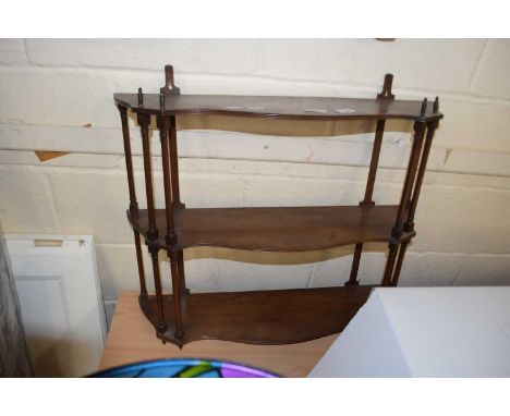 A 20th Century mahogany wall mounted serpentine front three tier shelf