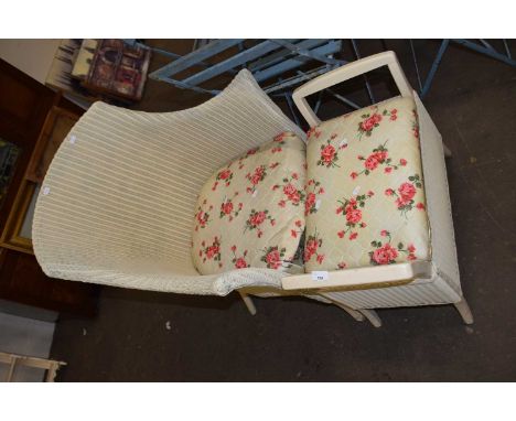 A Lloyd Loom chair and accompanying stool