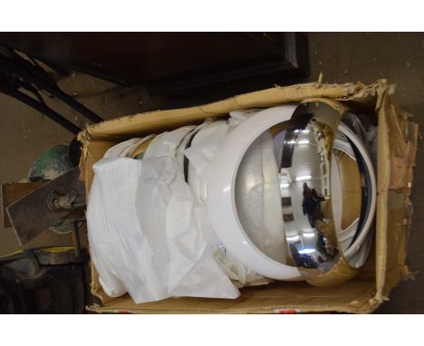 A box of plastic light fittings or frames