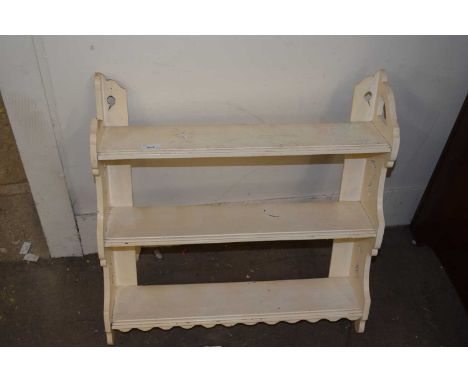A white painted wall shelf