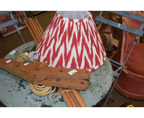 A clothes airer and a light shade