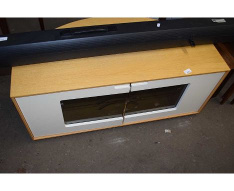 A light oak television cabinet