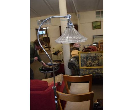 A standard lamp and glass shade