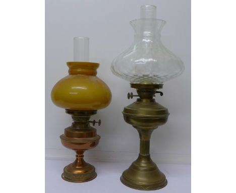 A brass oil lamp and a copper oil lamp